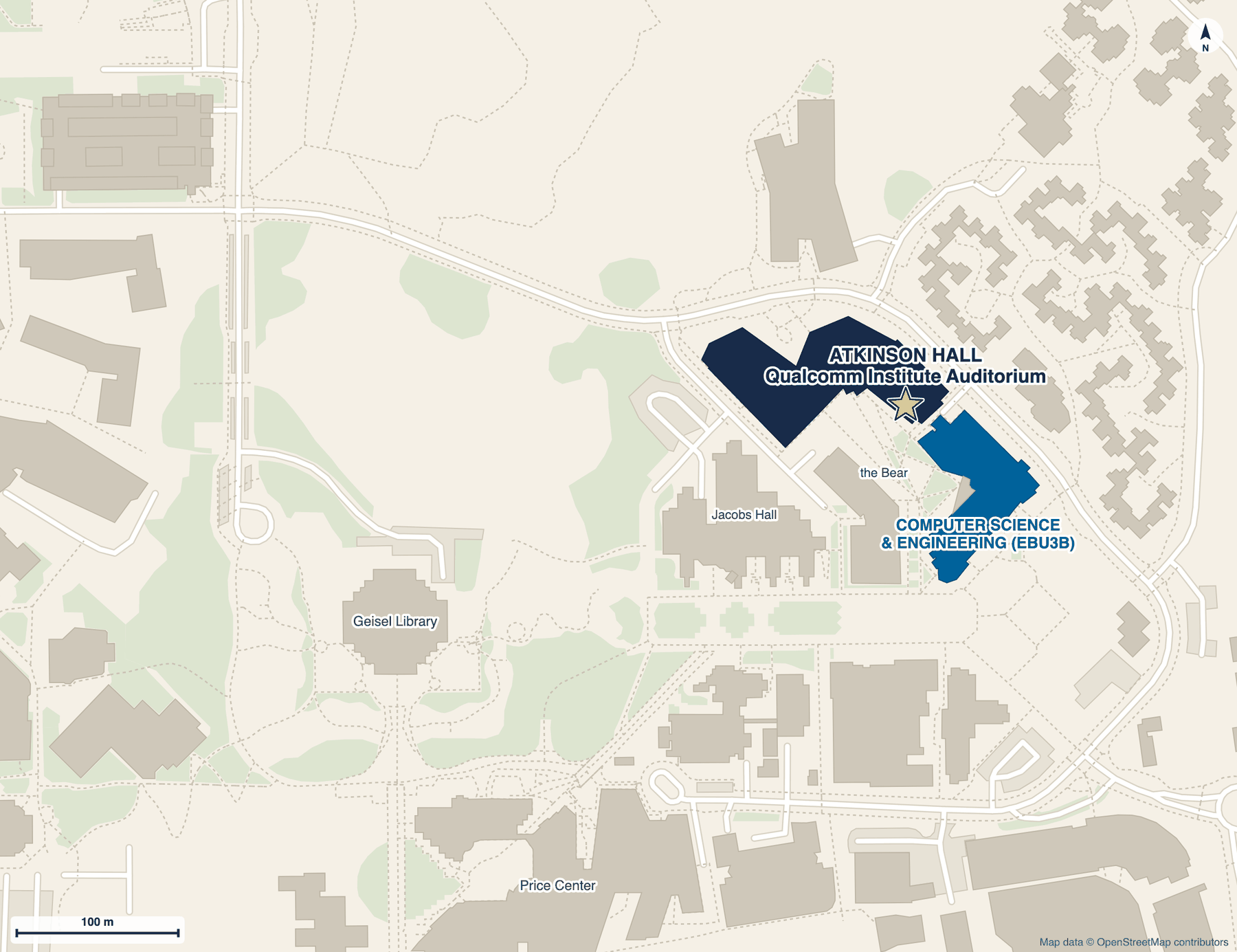 Campus map with a star marking the Qualcomm Institute Auditorium in Atkinson Hall, shown in dark blue. The Computer Science and Engineering building (EBU3B) is in blue just to the southeast. The Bear sculpture, Geisel Library, Price Center and Jacobs Hall are marked for orientation.